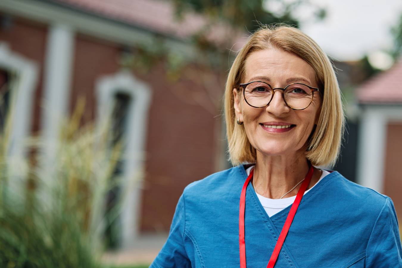 mature-female-healthcare-professional-in-blue-scru-2026-09-24-16-25-44-utc (1)